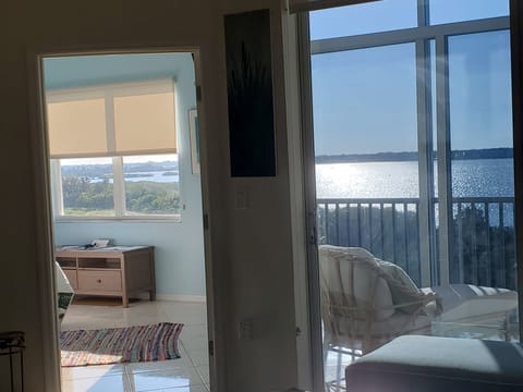 view from Living Room into Master Bedroom (left) and Balcony (right)
