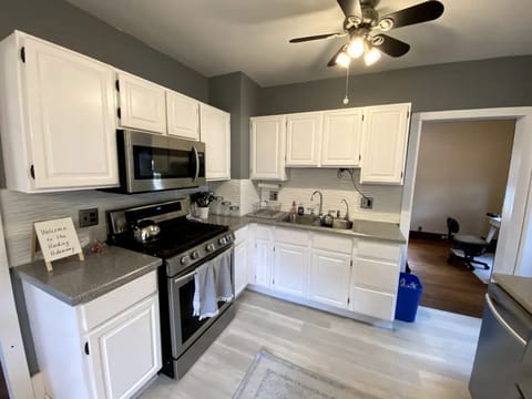 Spacious kitchen with stainless steel appliances.