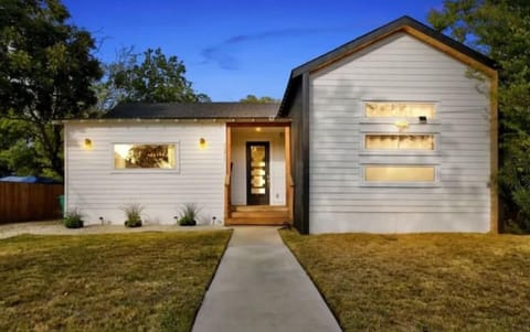 Home has out door lighting.  3 steps at front entrance, handrails for safety.