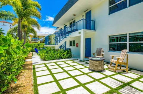 Tropical courtyard with cozy seating and island charm.