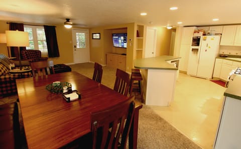 Open concept Living, Dining and Kitchen that opens into sunroom.