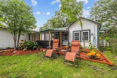 This 1955 beauty lies amongst an old Pecan Orchard and has 150 year old oak trees as a canopy. On non-Summer days/nights, you might find yourself enjoying the beauty of this charming neighborhood from this front covered patio.