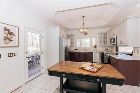 Wake up to the smell of fresh coffee and laughter in this fully equipped kitchen—perfect for slow mornings with loved ones or preparing your favorite holiday meals together. A space where memories are made, one meal (or cookie) at a time.