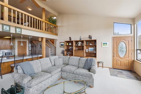 The comfortable Ethan Allen sofa is a perfect spot to relax with a book and warm yourself next to the wood-burning stove.