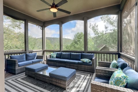 Screened-In Porch with a Cozy Seating Area to Enjoy the Beautiful Views