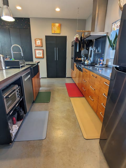 galley kitchen with black laundry room door