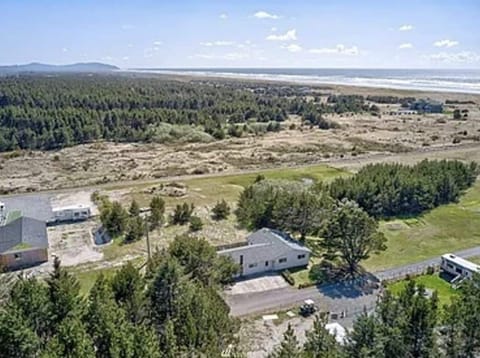 Single level home with two fire pits, large spacious yard and wildflower meadow.