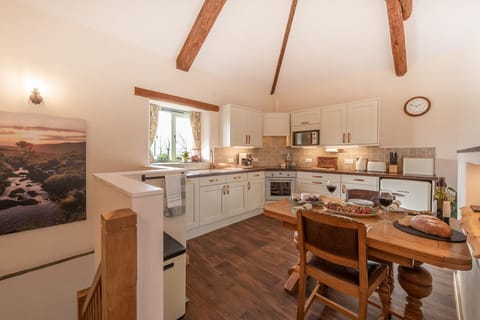 Large upstairs fully equipped kitchen with dining area for eating in