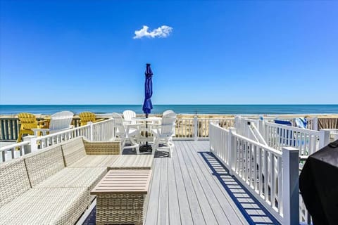Spacious deck with Oceanfront views and private beach access.