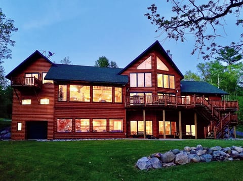 Lakeside view - all lake-level living overlooking big backyard and sand beach!