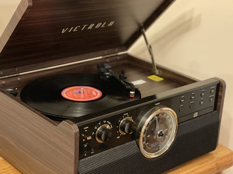 Games and music by the record player for cozy nights in