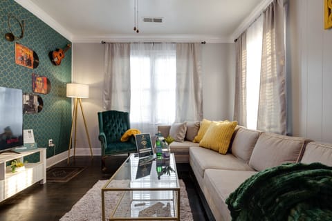 LIVING ROOM (music room) features 58 inches smart TV and a sleeper sofa