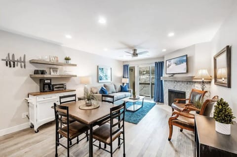 Cozy dining room looking across living room to porch balcony