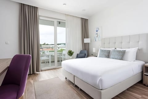 Relax together in a roomy suite with separate sleeping spaces.