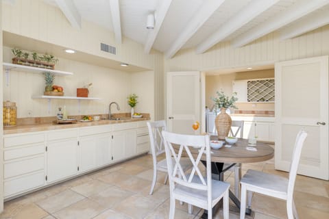 Additional prep and serving area near the kitchen provides extra space and a breakfast nook.