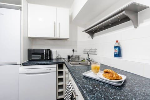 Kitchen. Fully equipped with cooking equipment perfect for families. Appliances such as fridge freezer, microwave, cooker, oven, dishwasher Toaster are free and available for your use.
