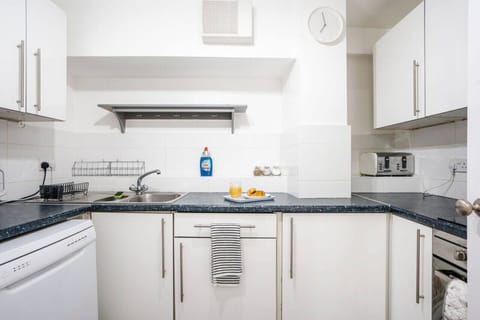 Kitchen. Fully equipped with cooking equipment perfect for families. Appliances such as fridge freezer, microwave, cooker, oven, dishwasher Toaster are free and available for your use.