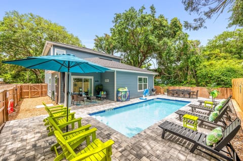 Escape to your own tropical oasis: enjoy the heated saltwater pool, charcoal grill, and outdoor shower!