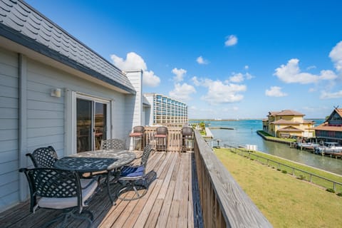Enjoy morning coffee on your private deck overlooking the sparkling bay, where coastal breezes and stunning water views create the perfect backdrop for relaxation.