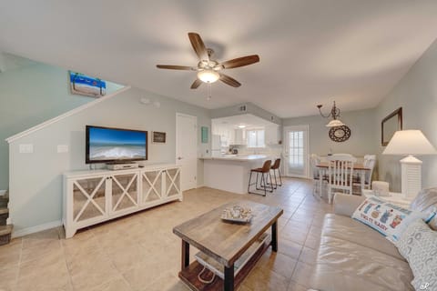 Living room with kitchen and dining area.