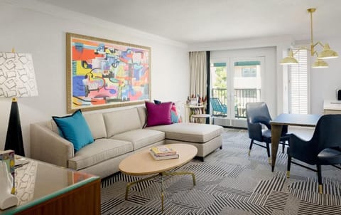Unwind on the plush sectional beneath bold, gallery-worthy art.