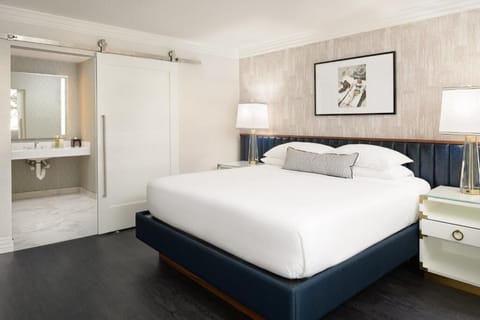 Recharge in a serene bedroom with convenient storage nearby.