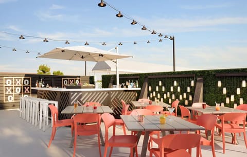 Settle in for rooftop happy hour with stylish, shaded seating.