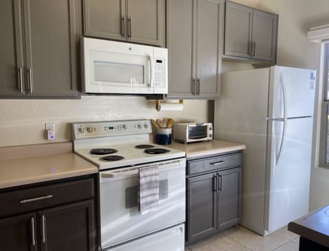 Beautiful two toned grey kitchen. Stove has been replaced since this photograph