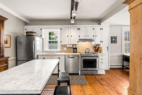 fully equipped kitchen with dining room table and all major appliances.