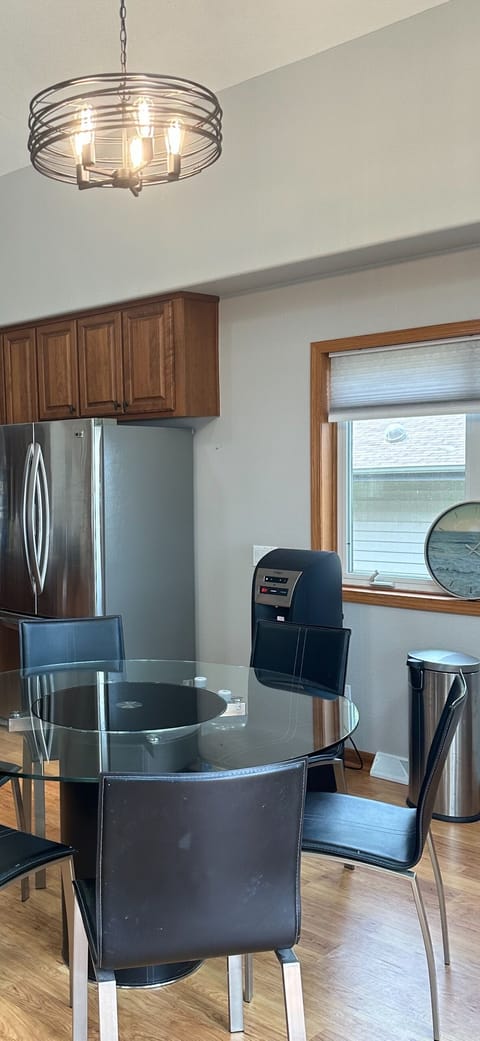 Breakfast table, refrigerator/freezer, bottled water dispenser.