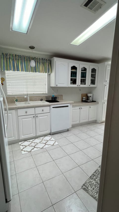 Large side by side fridge/freezer, generous counter space; toaster & coffee pot