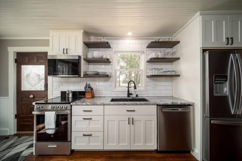 Fully stocked kitchen with stainless steel appliances