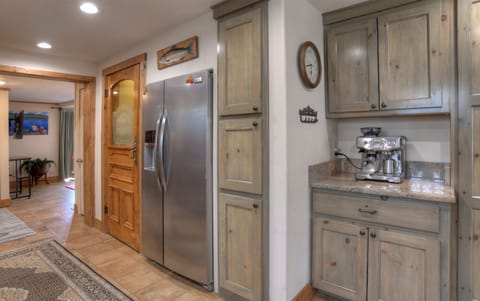 Gourmet kitchen with coffee bar, both drip coffee maker and expresso maker.