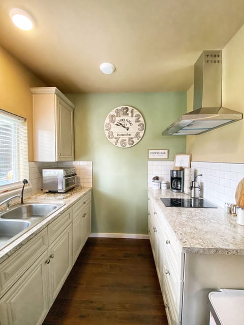 Kitchen area. Dishwasher, 2 burner quick range top, toaster oven & air fryer.