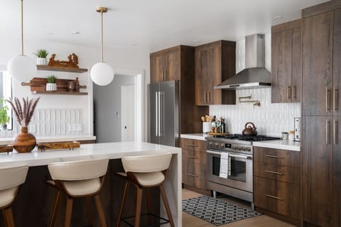 Cook and groove in this open kitchen space with 36" high end range.