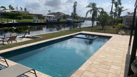 Pool with spa overlooks the canal