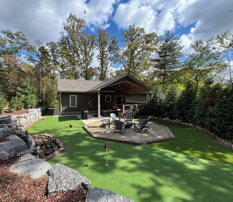 Backyard - Putting green, waterfall (seasonal), fire pit, hot tub, projector.
