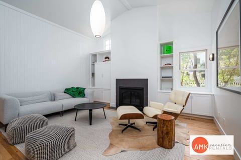 Living room with fireplace and TV