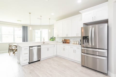 Cook and entertain in a wide, spacious, and sleek kitchen