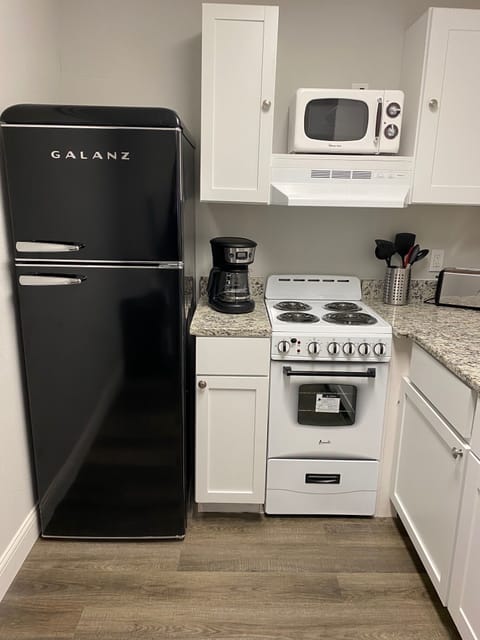 complete kitchen with dishwasher, range , microwave, refrigerator, washer/dryer