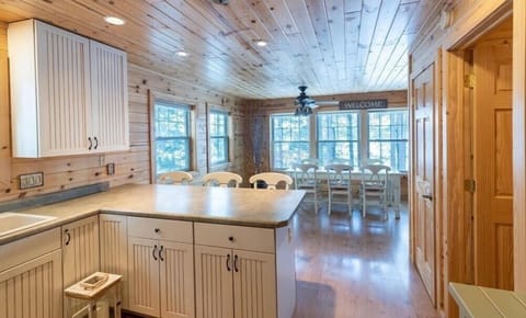 Spacious Kitchen with Large Pantry includes a Dishwasher, Microwave, Oven Range, and Refrigerator | Well stocked with dishes, drinkware, silverware, cookware, utensils, crockpot, mixer, blender, toaster oven/airfryer/convection oven combo.