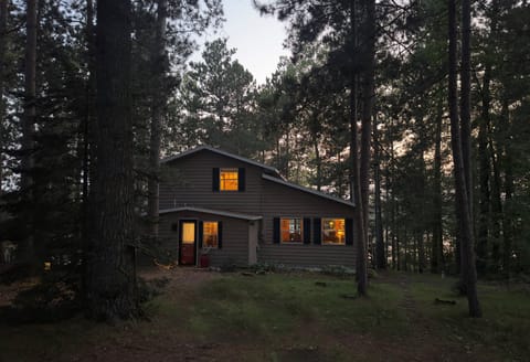 Tucked among red pines and overlooking the lake at golden hour, quiet, private, and just minutes from downtown and the Paul Bunyan State Trail.