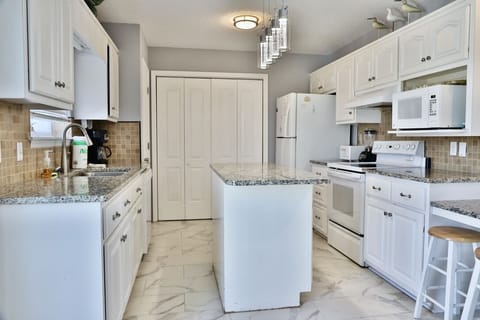 Upstairs fully stocked kitchen.