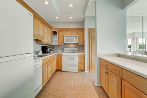 Full kitchen with place settings for 8 people.