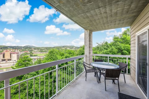 Relaxation on the Balcony - After a long day of fun, relax on the comfortable couch or gather around the table with friends and family to plan your next day's adventures.