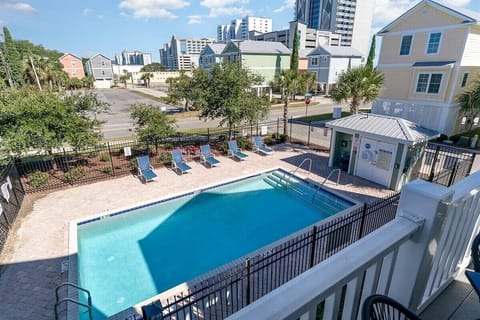 Relax by your fenced-in swimming pool, located just steps from the house and a few short blocks from the beach.