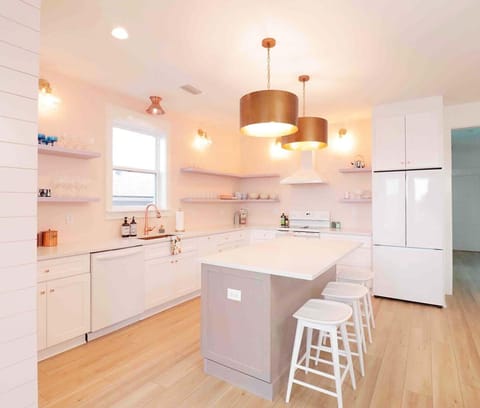Spacious full-size kitchen with lots of light and sparkling quartz countertops