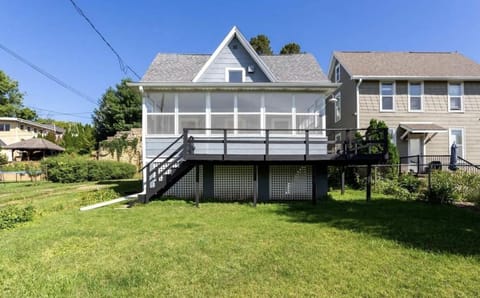 Back porch/3 seasons room & small flat yard.