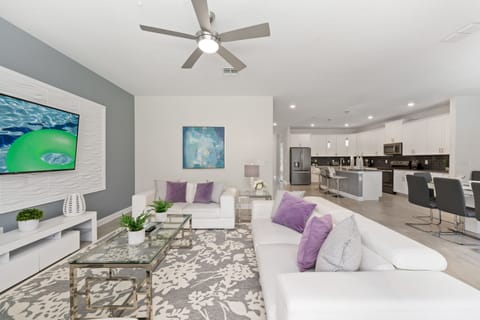 The house features open-concept spaces, ideal for spending time with friends and family.