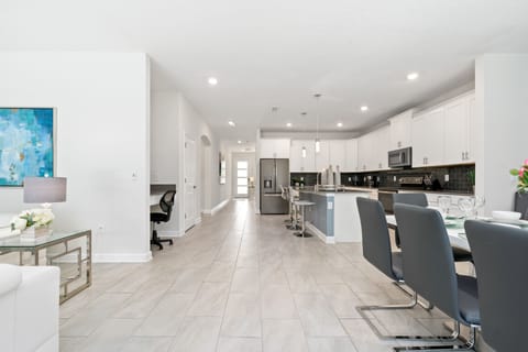 The house features open-concept spaces, ideal for spending time with friends and family.